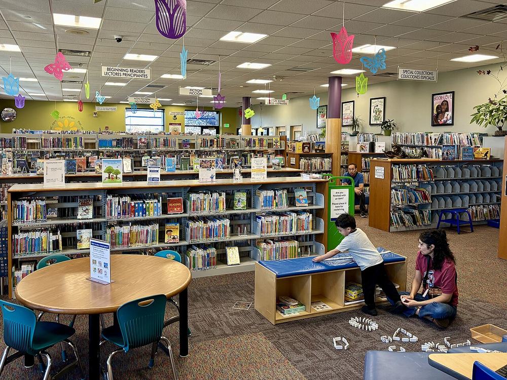 Low shelves and tables in the children's section of a public library